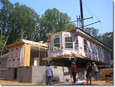 Shores Construction setting modular  home on foundation